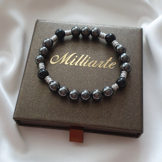 Handgefertigtes Onyx Hämatit Armband mit Edelstahl Elementen - hochwertiger Heilstein Schmuck zur Erdung, Schutz und Energiebalance, in edler Schmuckbox mit Logo.